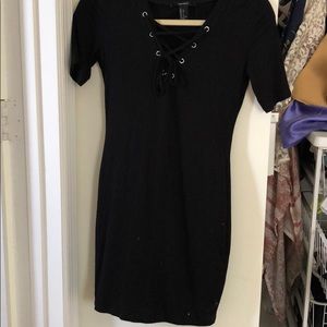 black fitting minidress w/ lace up neck